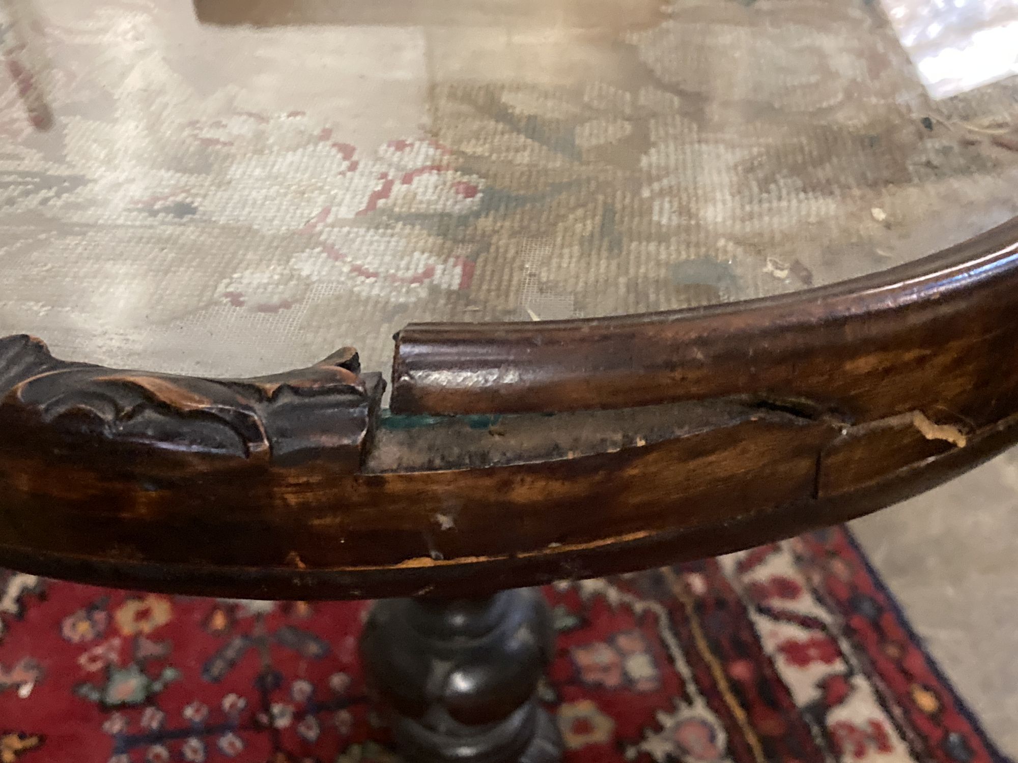 A Victorian rosewood table, with square floral tapestry inset top, over fluted bulbous pillar and triform platform base, height 63cm to